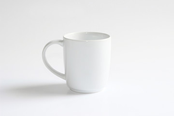 White ceramic mug. Isolated on a white.