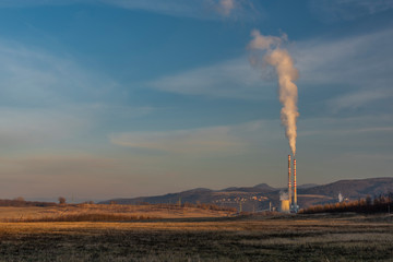 Factory in Usti nad Labem city from Milada lake in winter evening