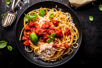 delicious appetizing classic spaghetti pasta with tomato sauce, parmesan - obrazy, fototapety, plakaty