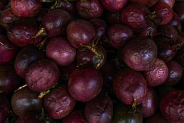 Whole passion fruits background
