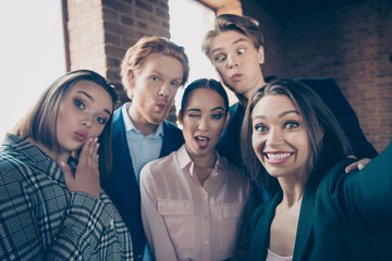 Self-portrait of nice chic stylish elegant luxury beautiful attractive handsome cheerful positive comic childish playful humorous staff at modern industrial loft interior workplace workstation