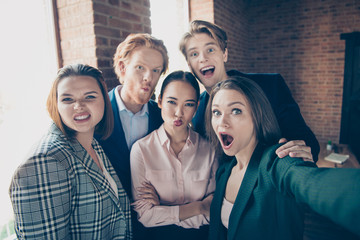 Self-portrait of nice elegant luxury beautiful attractive handsome cheerful positive comic childish playful crazy foolish air blow kiss staff at modern industrial loft interior work place station