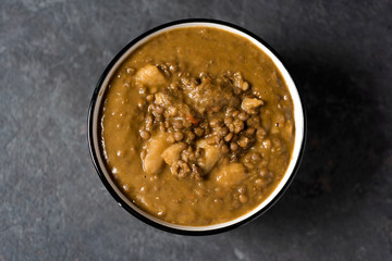 lentil stew in a white ceramic bowl
