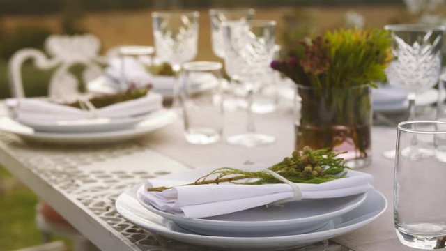 Table set for dinner party outdoors. Elegant table setting for a party.