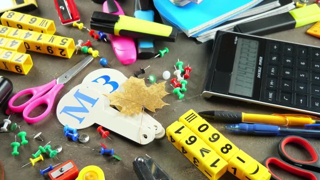 Back to school. Items for school classes in the composition on the table.