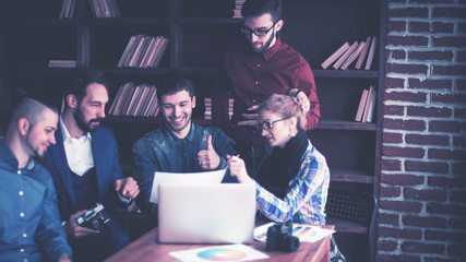 team of copywriters discussing a new advertising project