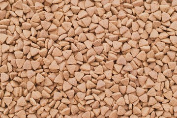 Dry food for cats or doggs - kibble. Organic texture background
