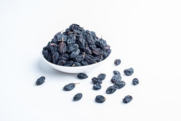 Black currant dried on white background