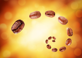 Set of fresh roasted coffee beans isolated on a beautiful coffee background