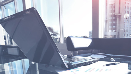 Closeup photo of a laptop computer with an open top in  modern office