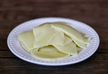 Bamboo shoots on wood background. Ready to cook.