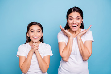 Close up photo pretty two people brown haired mum little daughter eyes mouth opened unbelievable...