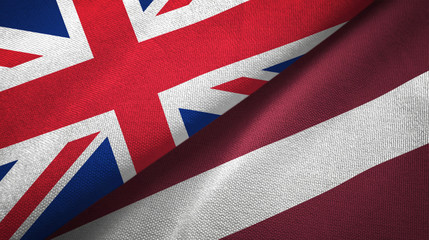 United Kingdom and Latvia two flags textile cloth, fabric texture