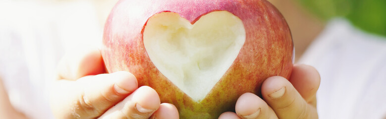 Child with Child with an apple. Selective focus.