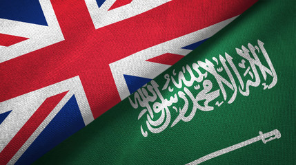 United Kingdom and Saudi Arabia two flags textile cloth, fabric texture