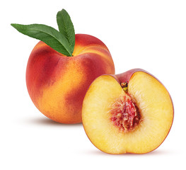Ripe peach fruit and one cut in half with bone and leaf