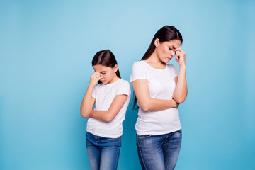 Close up photo two people brown haired mum disinterested small little daughter hand on face sick...