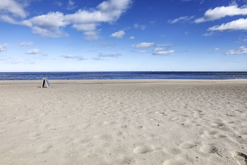 Fototapeta na wymiar Beach of sand and sea landscape with blue sky and clouds 