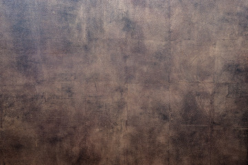 Bison skin. Texture of bison leather. Skin texture. Bison leather, bronze color, brown color. The texture of the painted skin of bison. Leather for a background texture. © Artem