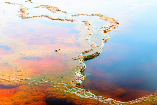 Natural mineral formation in clear water of Rio Tinto river with smooth surface, Huelva