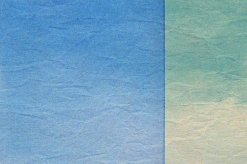 Texture of blue and green crumpled paper