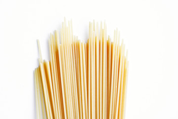 Yellow long spaghetti on a light background. Thin pasta arranged in rows. Italian raw pasta. Food...