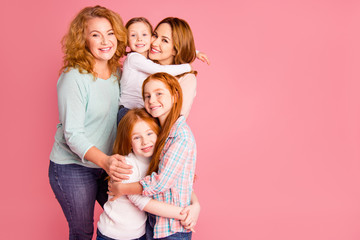 Close up family children day photo set three foxy little girls mom granny five stand close tight vacation weekend spend time wear sweaters shirts pullovers isolated on rose background