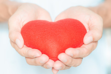 handsome man holding red heart in hands giving for love life healthy care medicine hospital concept and lovely romantic for valentines day.