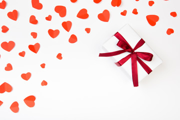 Valentine day composition: .gift boxe with bow and red  hearts, photo template, background. Top View.