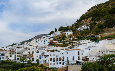 small village houses painted in white in a hilly landscape