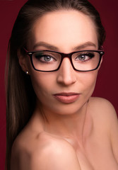 beautiful portrait girl model with eyeglasses red frame beauty shoot blue eyes