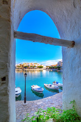 The lake Voulismeni in Agios Nikolaos,  a picturesque coastal town with colorful buildings around the port in the eastern part of the island Crete, Greece