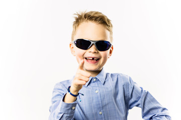 happy boy without a front tooth smiling over white background