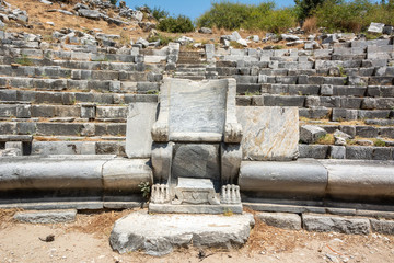 Prohedria marble seat at ruined theatre of Priene ancient city in Turkey.