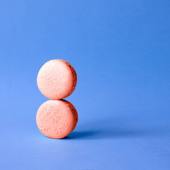 Two macaroon coral color imitating the number 8.