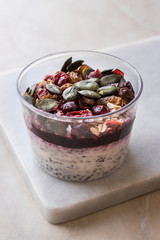 Healthy Chia Pudding with Pumpkin Seeds / Acai Bowl in Plastic Cup
