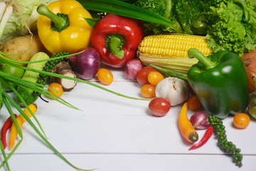Raw organic vegetables on white wooden background, Healthy food.