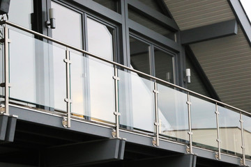 Balcony railing made of glass and stainless steel - obrazy, fototapety, plakaty