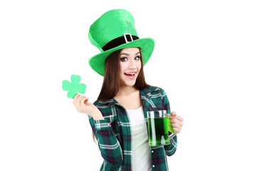 St. Patrick's Day. Beautiful woman wearing green hat with beer and paper clover