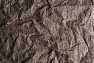 Linen crumpled natural fabric background