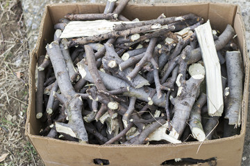 cut wood for heating packed in a cardboard box.firewood packed in a cardboard box