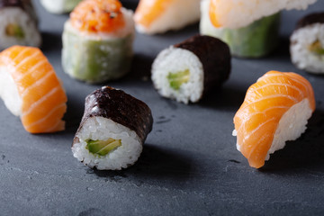 Fresh seafood sushi meal on darck background