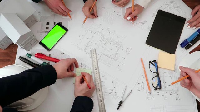 Shown close up on the drawing of building drawing pencils and drawbacks. As well as make notes with a pencil on the sticker.
