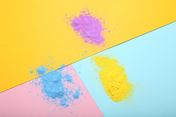 Holi powders on colorful background