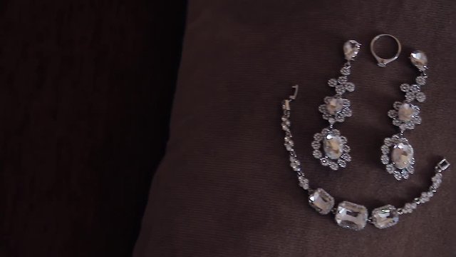 Women's jewelry earrings, bracelet. White gold, platinum or silver with diamonds. Luxury