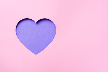 Valentines day card. Cutted heart in punchy pastel paper background. Minimalist concept. Love, date, romantic concept.