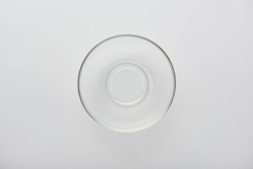 top view of transparent glass bowl on grey background