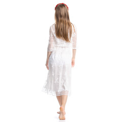 Woman in white dress summer spring laced goes on white background isolation, back view
