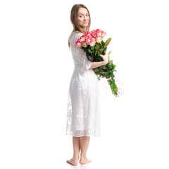 Woman in dress with flowers roses in hand on white background isolation, back view