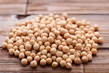 Chickpeas on brown wooden table